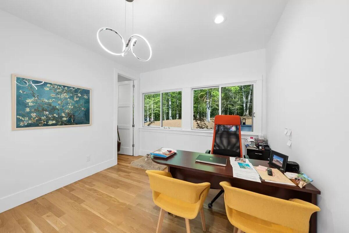 Check Out the Artistic Pendant Light in This Bright Home Office
