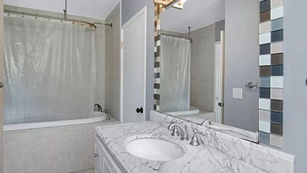 Spot the Textured Tile Border Adding Flair to This Bathroom