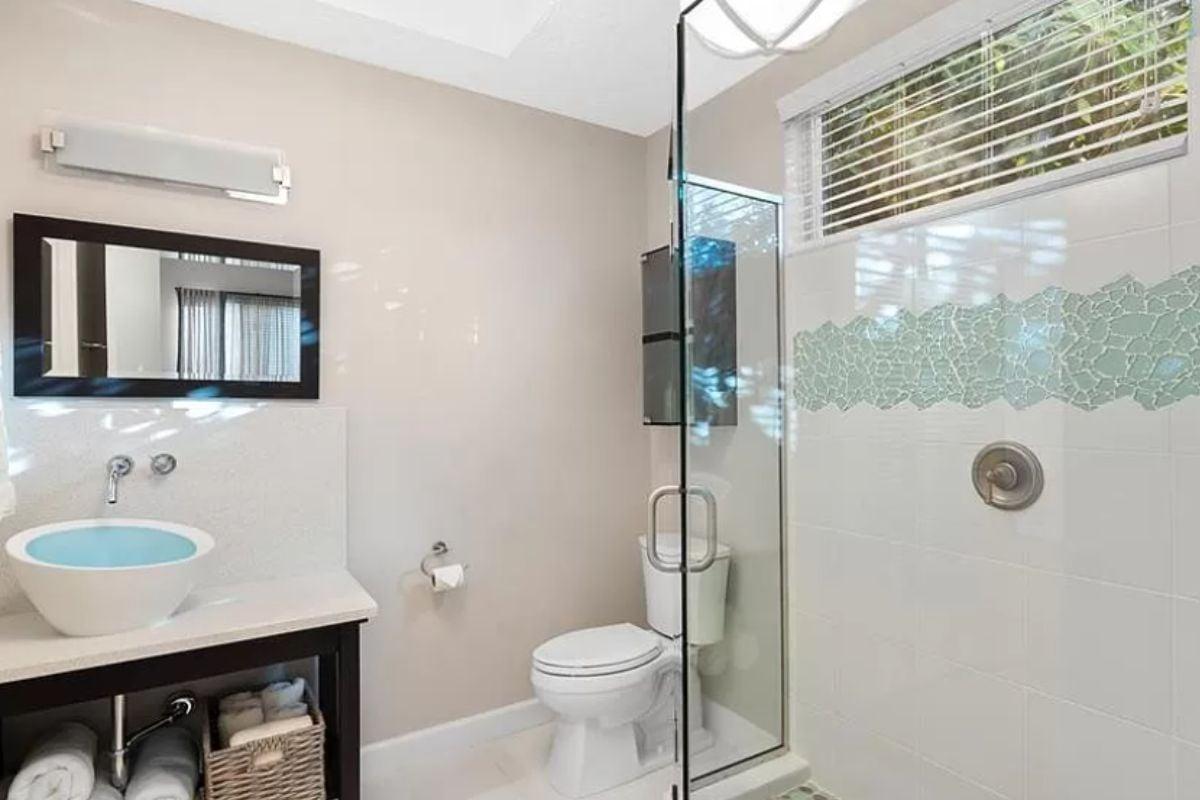 Explore the Unique Mosaic Accent Tile in This Elegant Bathroom