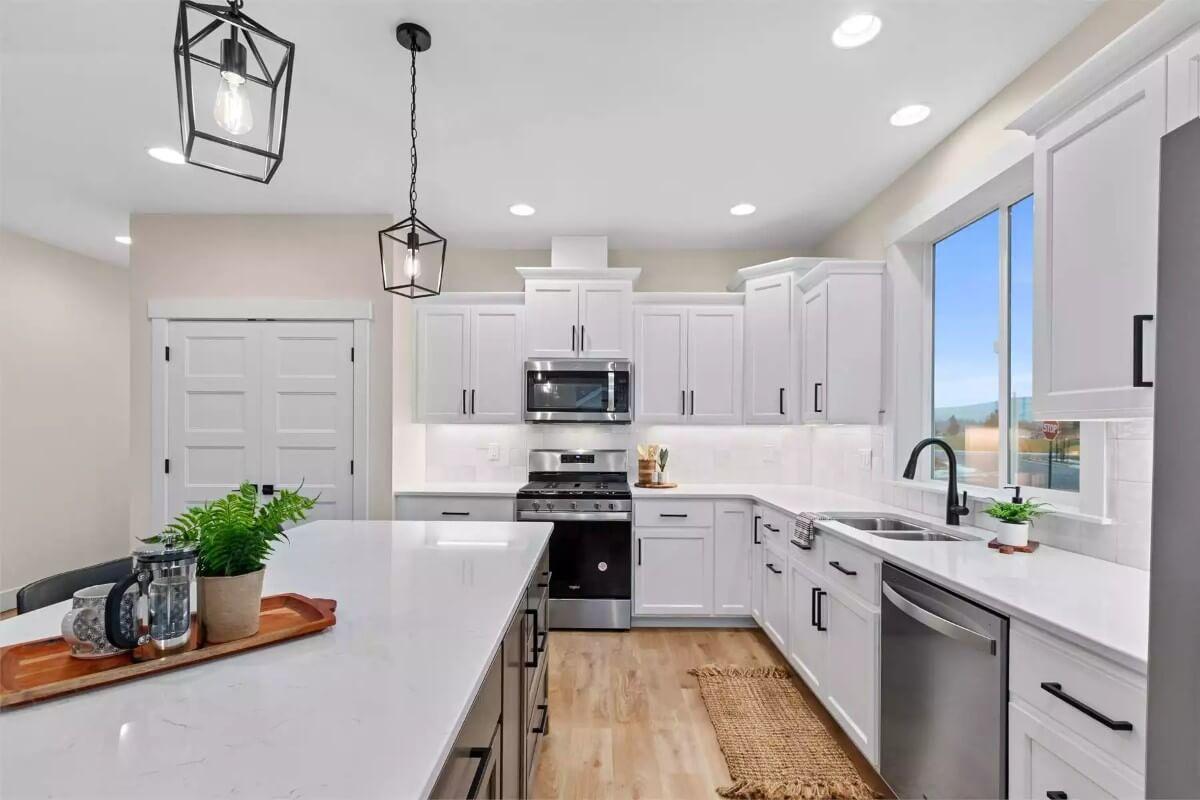Notice the Crisp White Cabinetry and Sleek Black Hardware in This Bright Kitchen