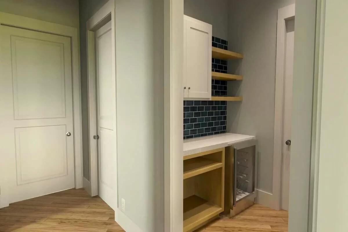 Check Out the Dark Subway Tile in This Compact Bar Nook
