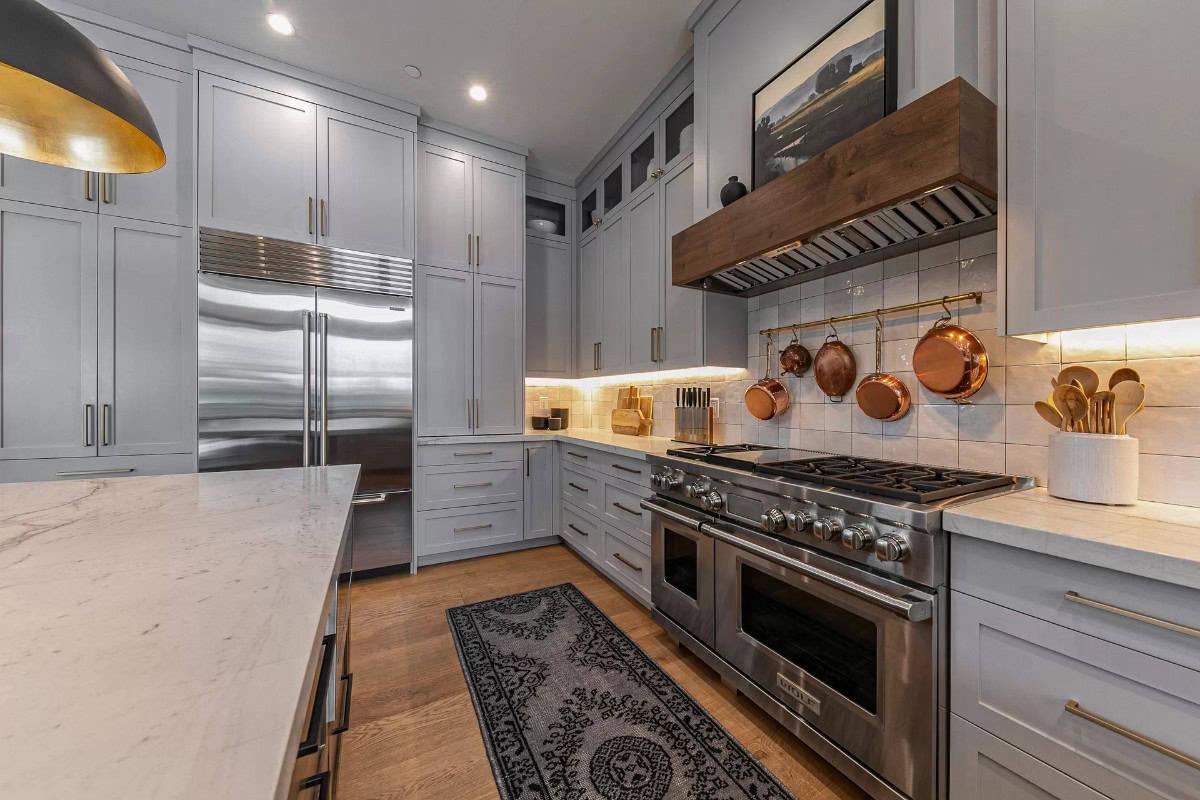 Notice the Elegant Copper Pots Perfectly Complementing This Sleek Kitchen