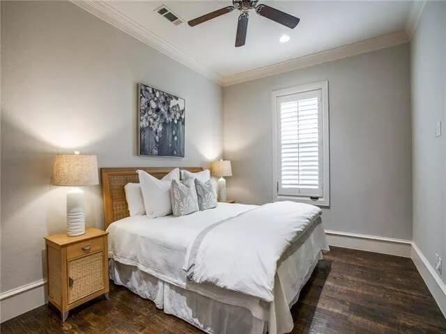 Simple Yet Stylish Bedroom Highlighting a Subtle Ceiling Fan