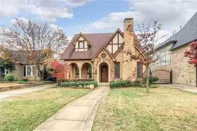 Charming Tudor-Style Home with Eye-Catching Stone Chimney