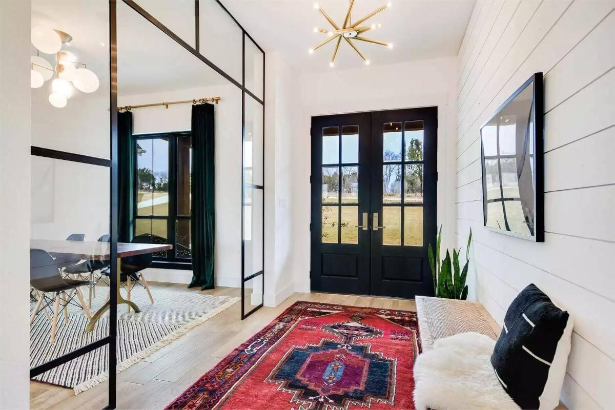 Wow, Check Out the Bold Entryway with Those Stunning Black Doors
