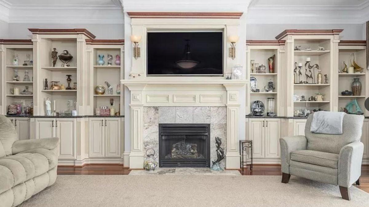 Classic Living Room with Built-In Display Cabinets Flanking the Fireplace