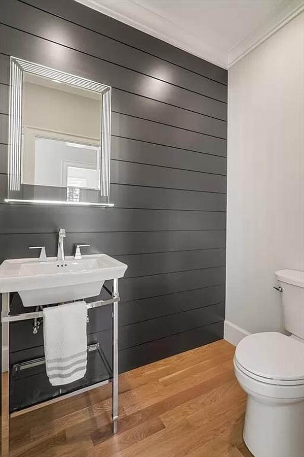 Notice the Dark Shiplap Accent Wall in This Stylish Powder Room