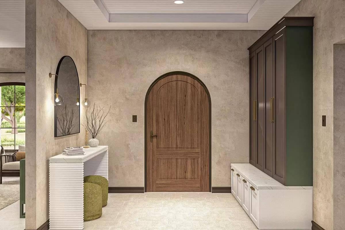 Arched Doorway in This Chic Mudroom with Functional Built-Ins