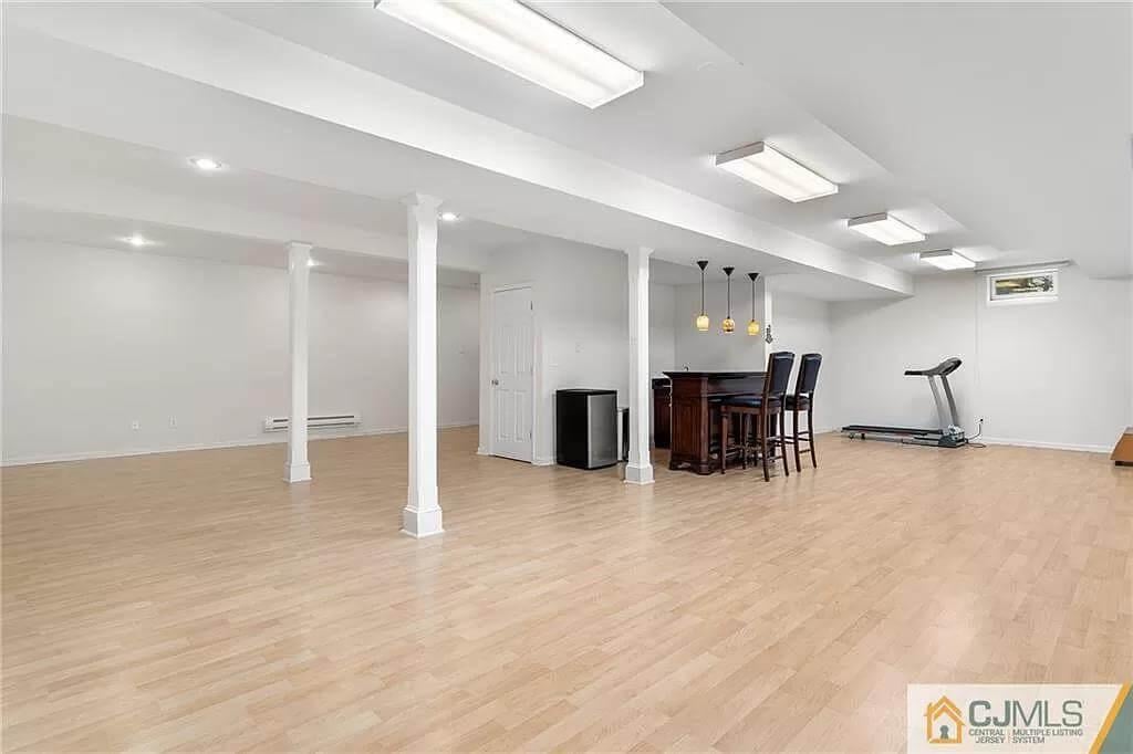 Spacious Basement with a Home Bar and Workout Area