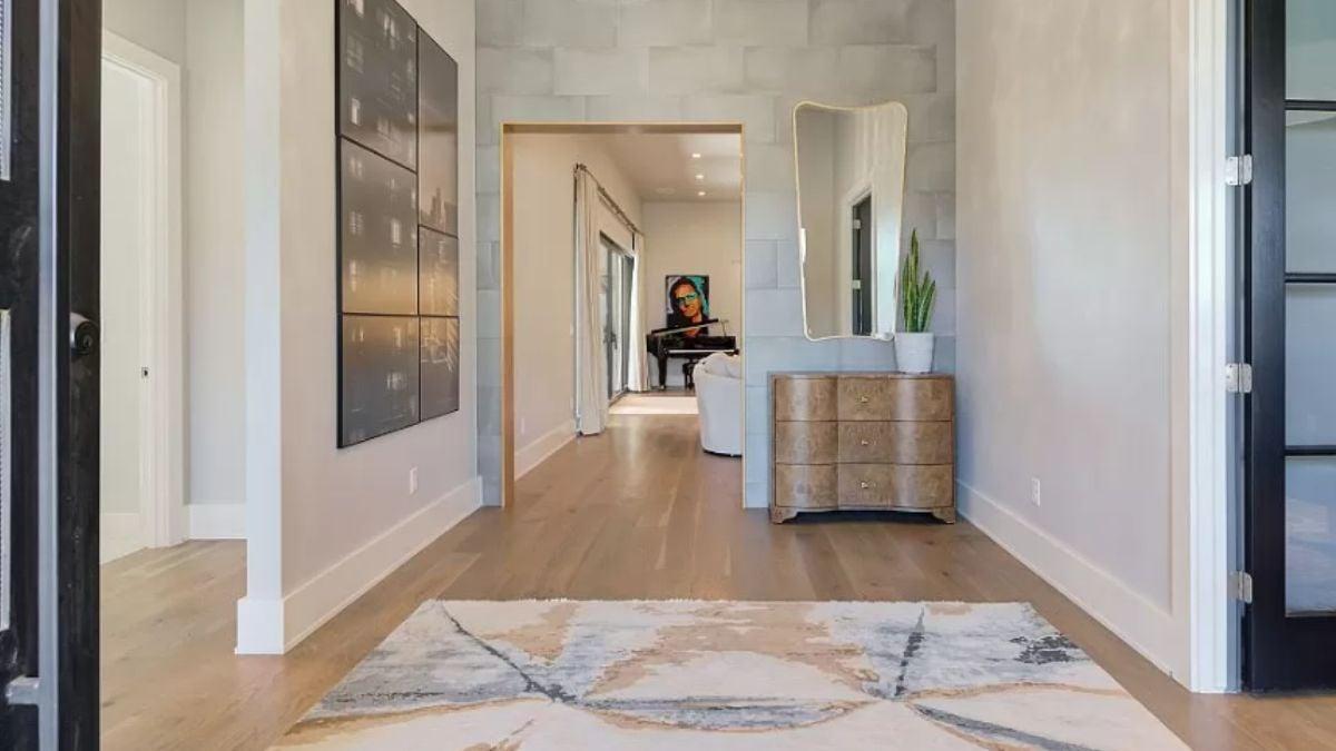 Explore This Light-Filled Hallway Featuring Bold Artwork