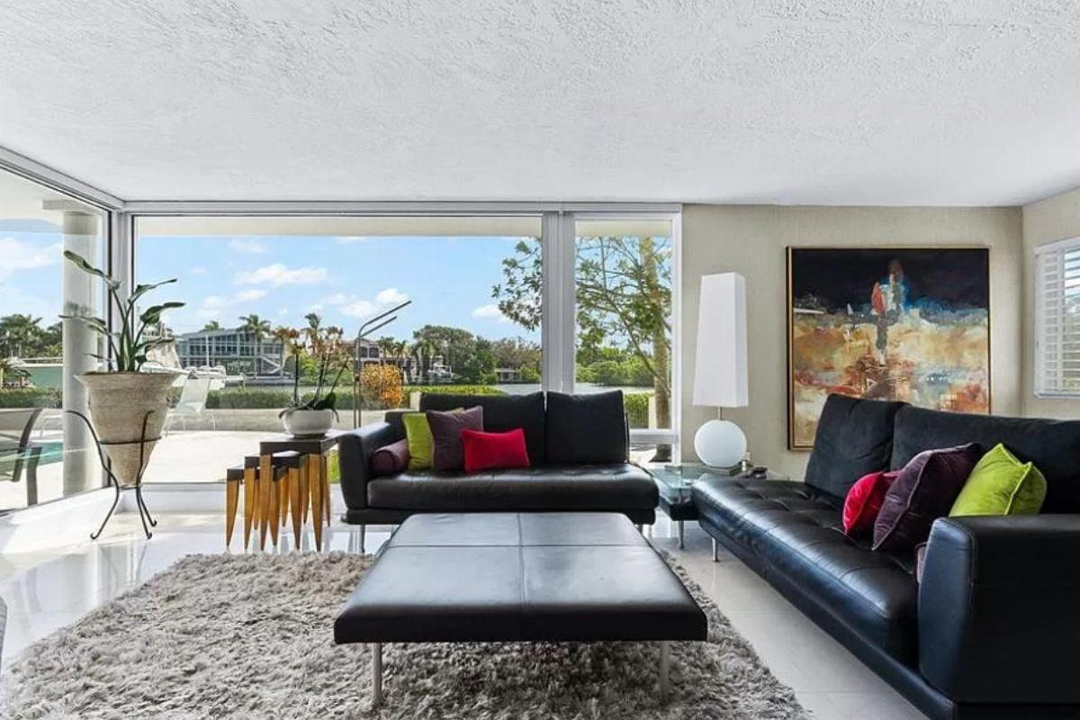 Modern Living Area with Expansive Windows and Pops of Color