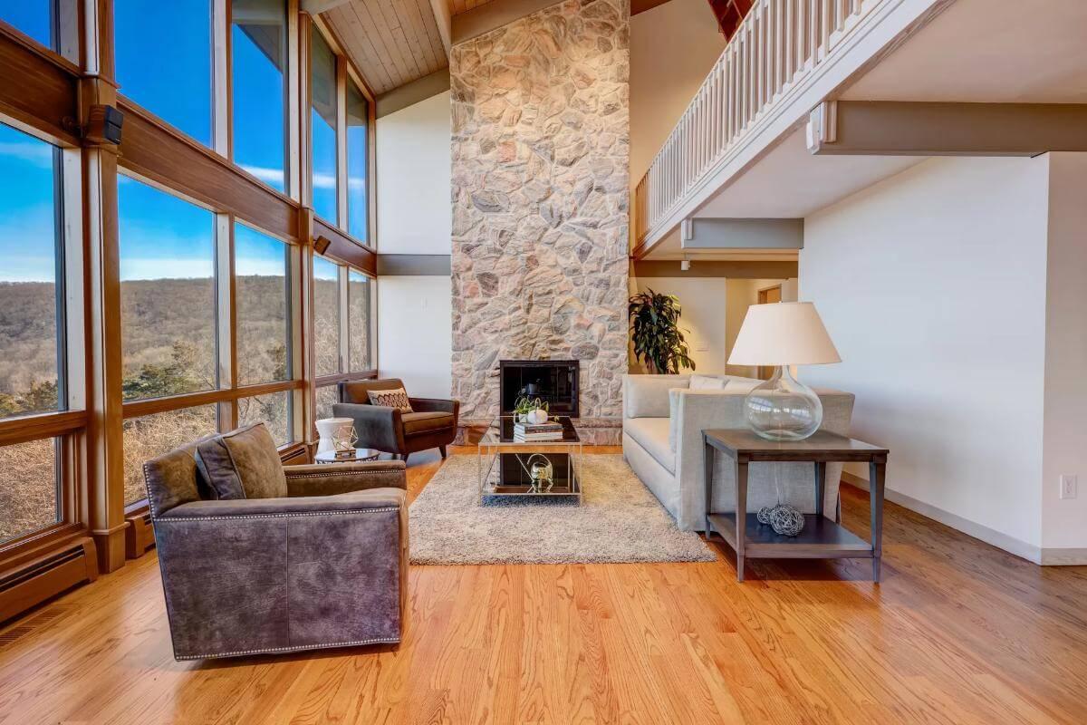 Wow, Look at That Towering Stone Fireplace in This Living Room