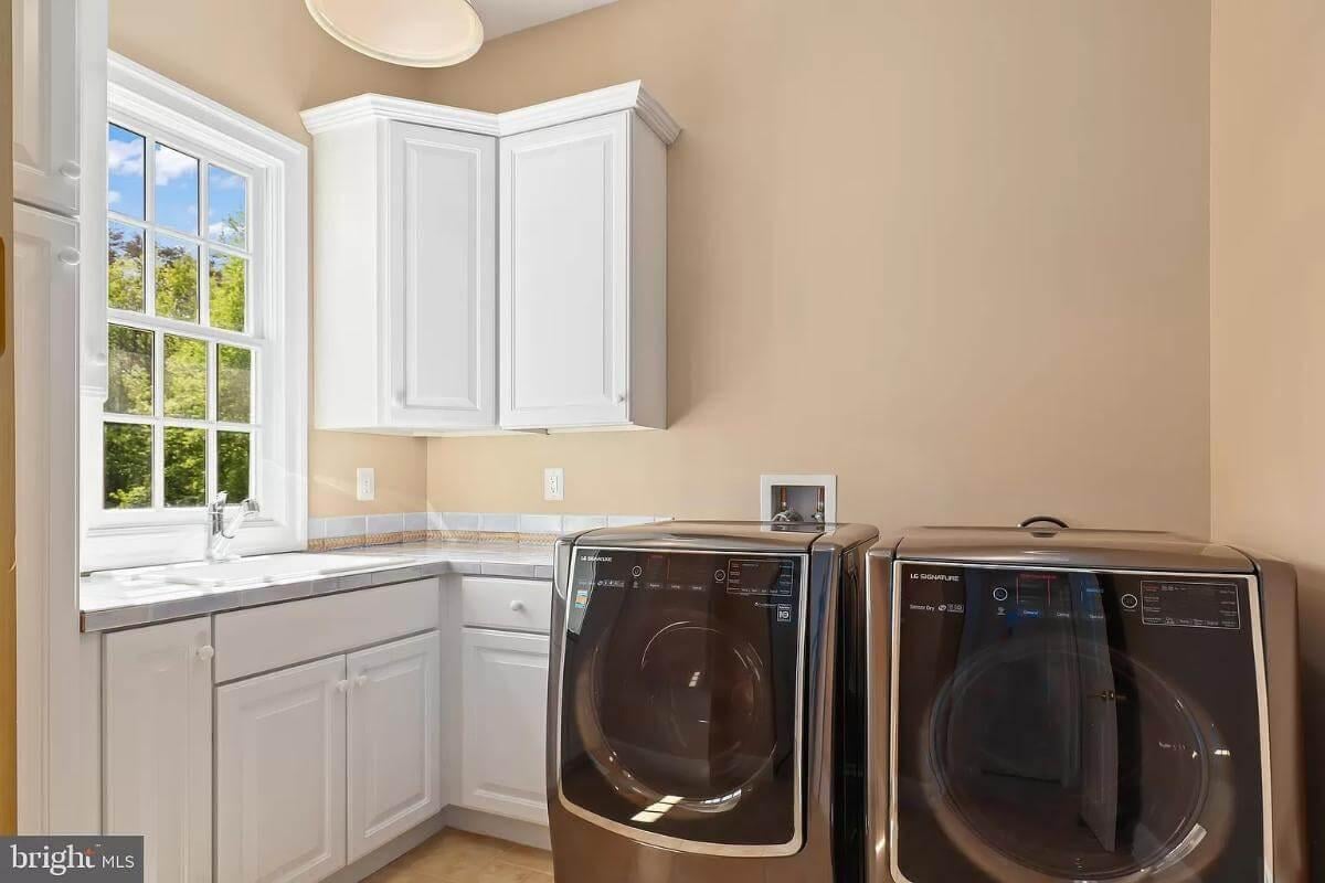 Efficient Laundry Room with a Bright Corner Sink