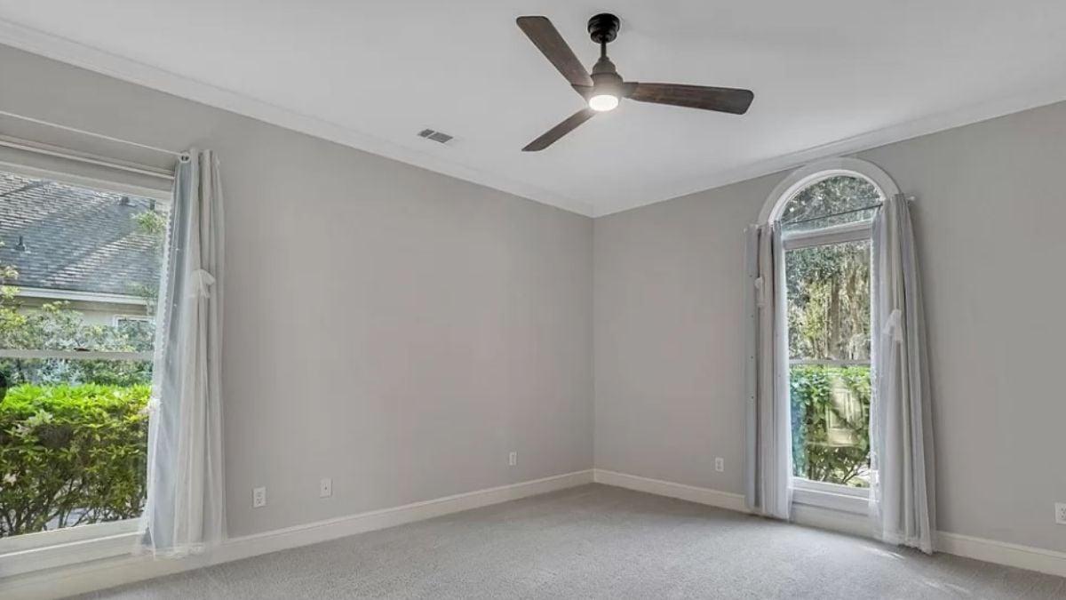Simple Elegance with Those Arched Windows and Ceiling Fan