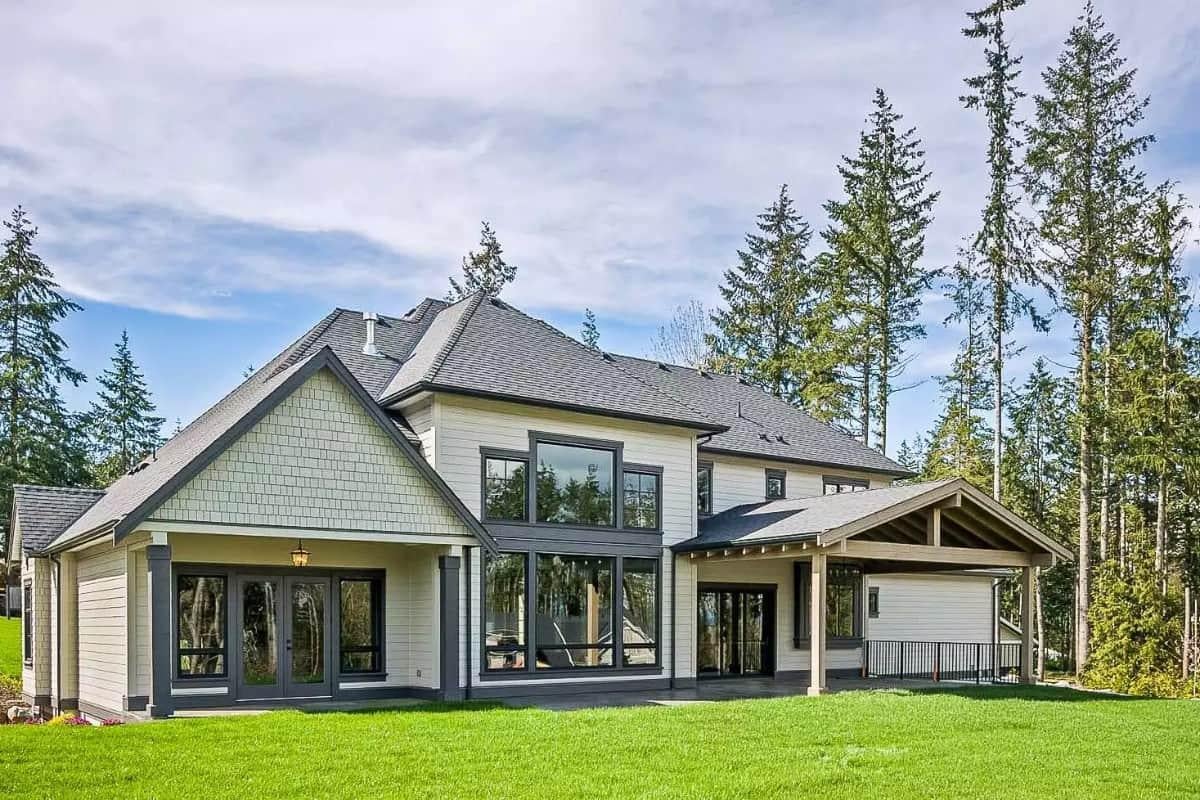 Marvel at the Expansive Windows and Timber Accents in This Craftsman Gem