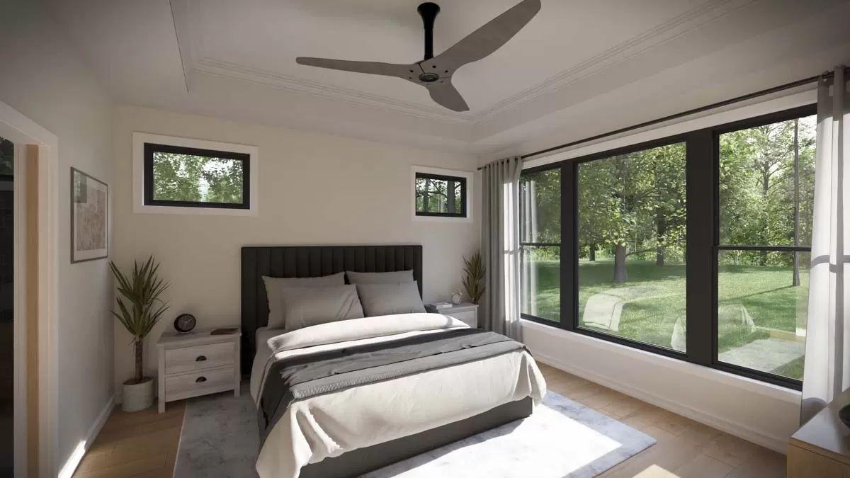 Bright Bedroom with Expansive Windows Overlooking Nature