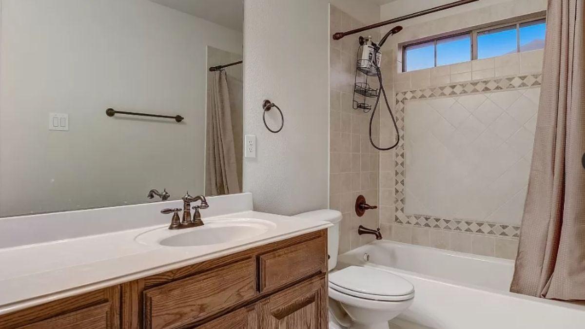 Spot the Classic Tile Border in This Functional Bathroom