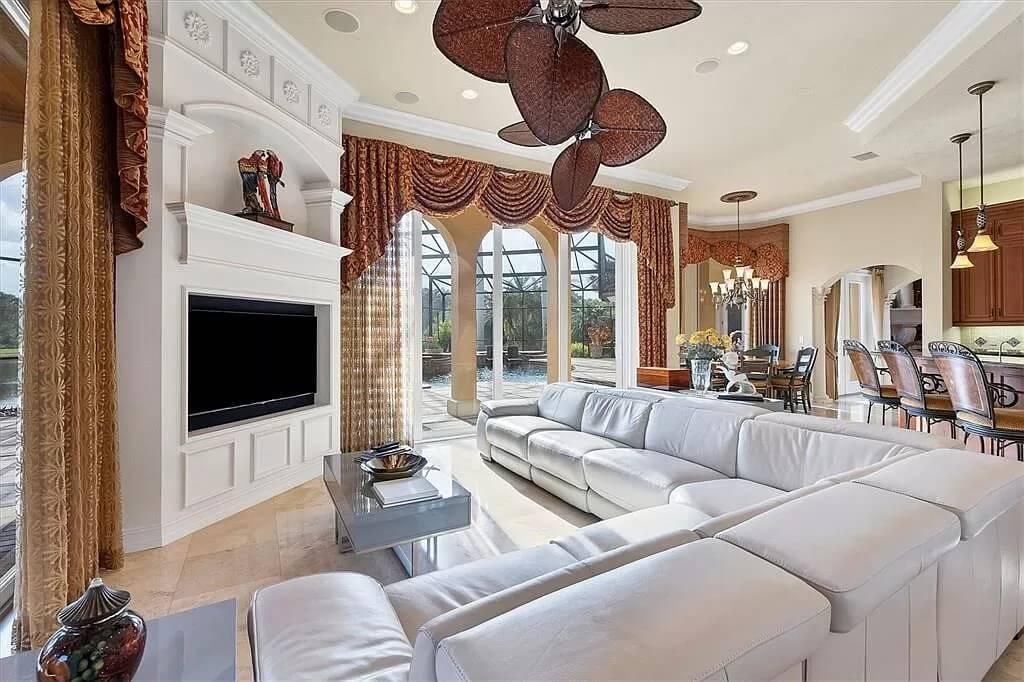 Wow, Check Out the Palm-Inspired Ceiling Fan in This Luxurious Living Room