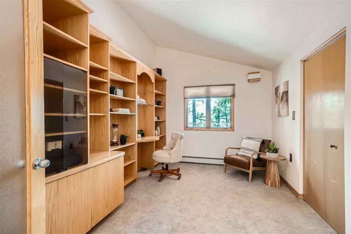 Notice the Generous Built-In Shelving in This Home Office
