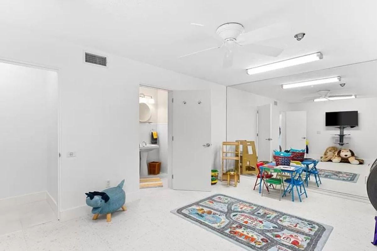 Wow, Look at This Bright Playroom with a Clever Mirror Wall