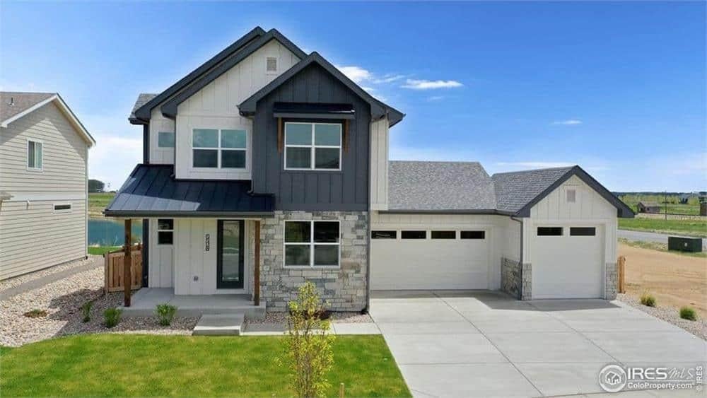 Modern Farmhouse with Striking Stone Facade and Dual Garage