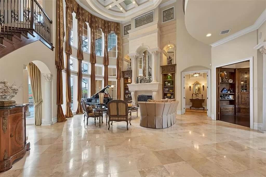 Notice the Dramatic Floor-to-Ceiling Windows in This Lavish Living Room
