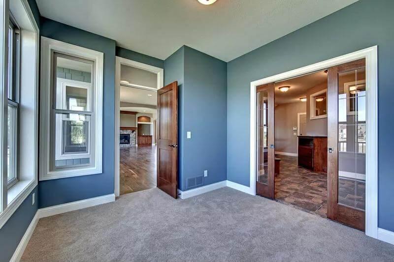 Versatile Room with Dual Entries and Rich Wood Trim