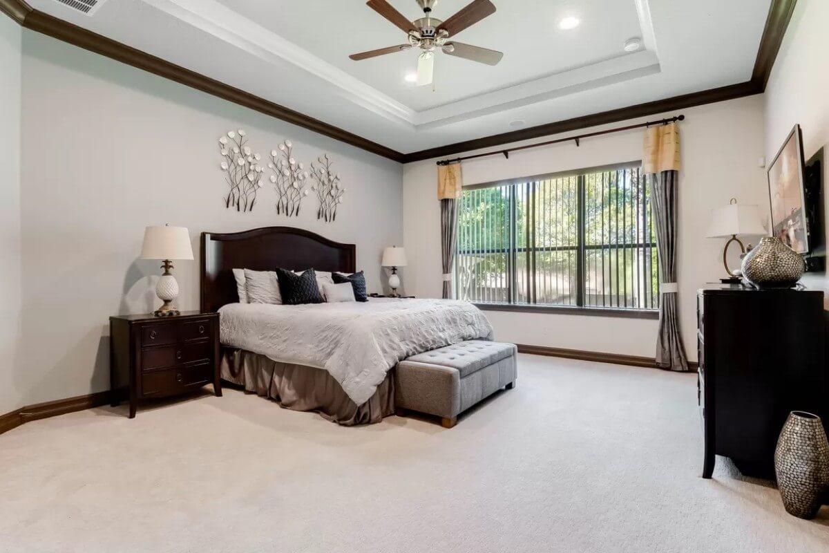 Classic Bedroom with Tray Ceiling and Large Windows