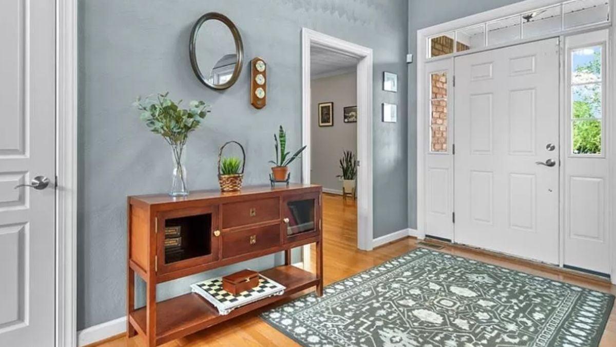 Charming Foyer with Vintage-Inspired Console and Decorative Accents