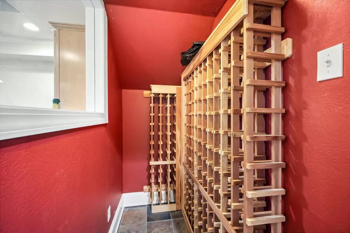 Wow, Check Out the Bold Red Walls of This Chic Wine Cellar