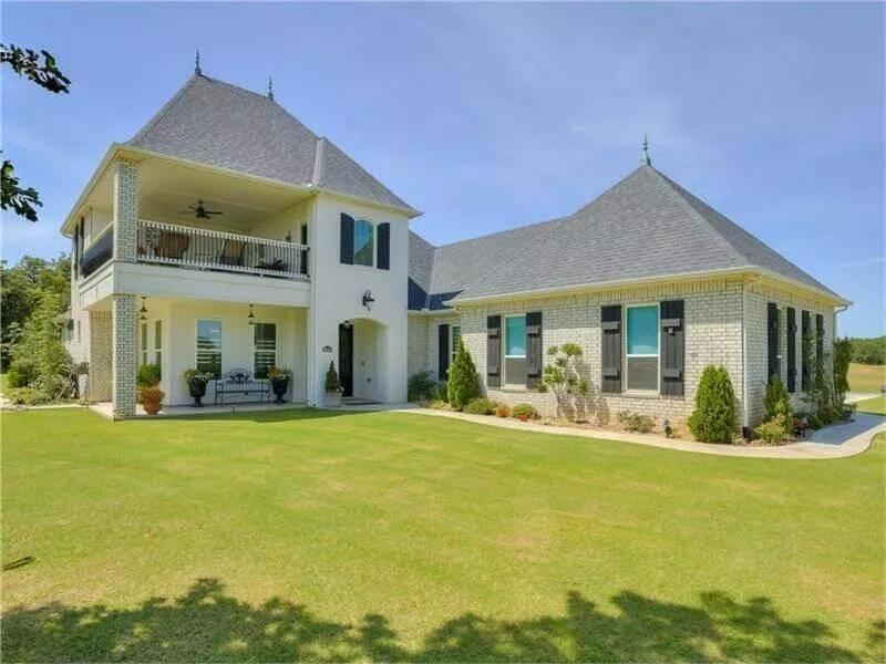 Grand Exterior with French Influences and a Balcony to Enjoy