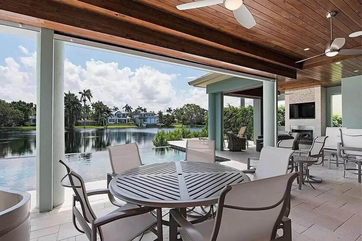 Experience the Seamless Flow of Indoor-Outdoor Living on This Lakeside Patio