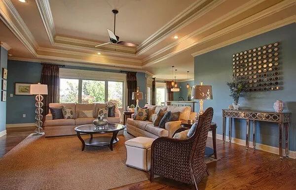 Stylish Living Room Highlighting a Tray Ceiling and Statement Art Piece