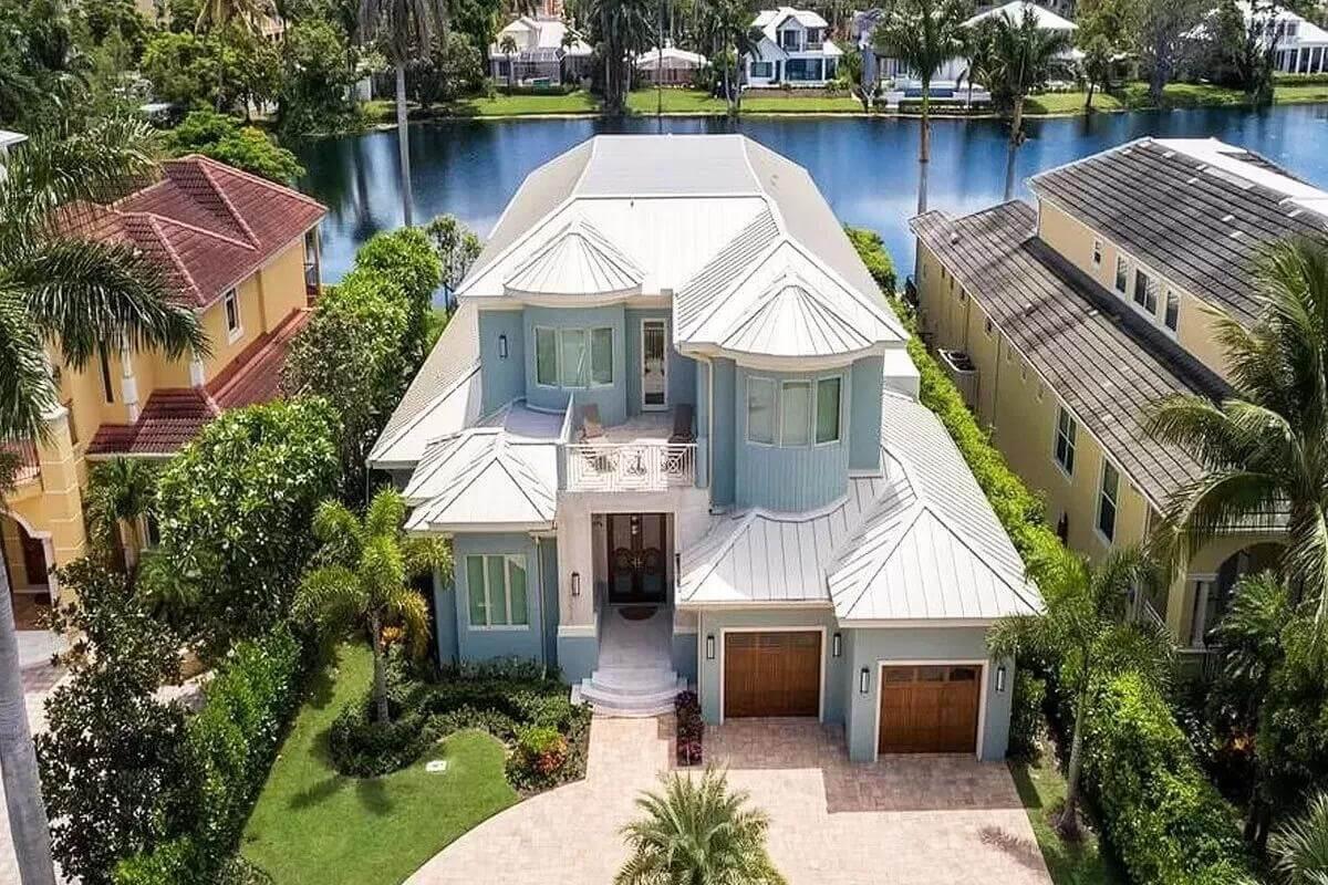 Notice the Unique Rotunda and Dual Garage Doors on This Coastal Gem