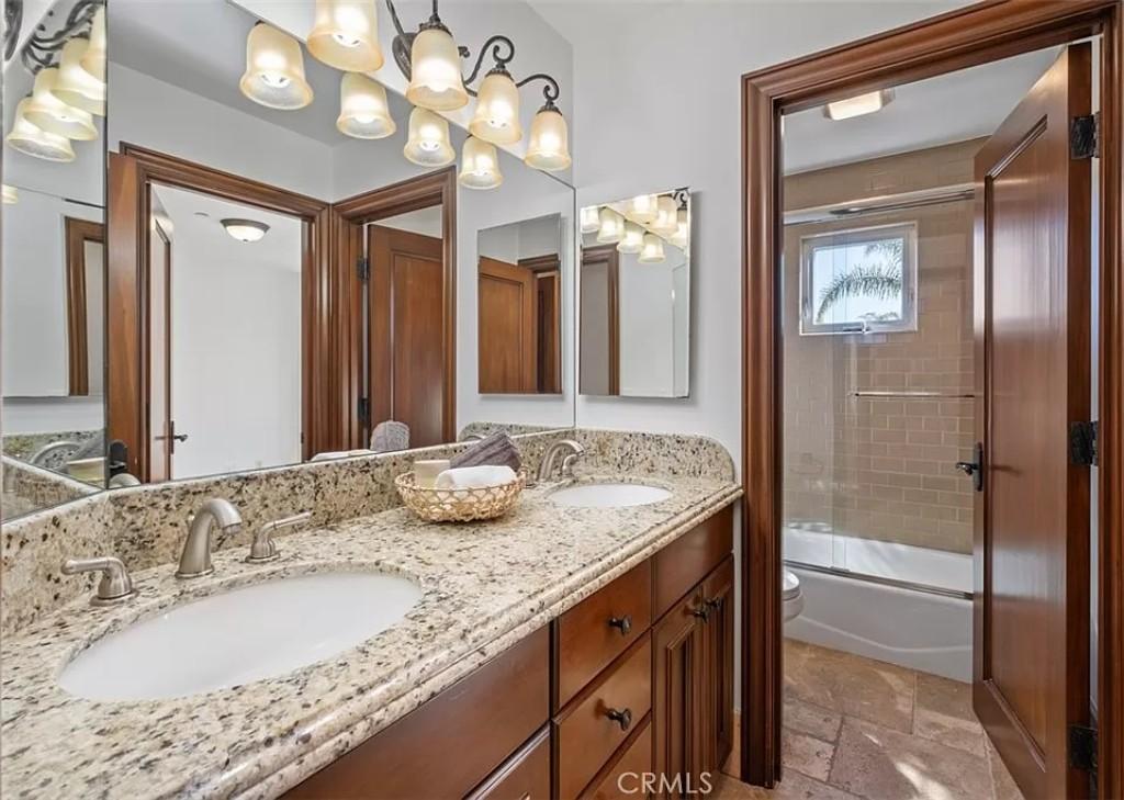 Look at the Dual Vanities and Granite Counter in This Elegant Bathroom