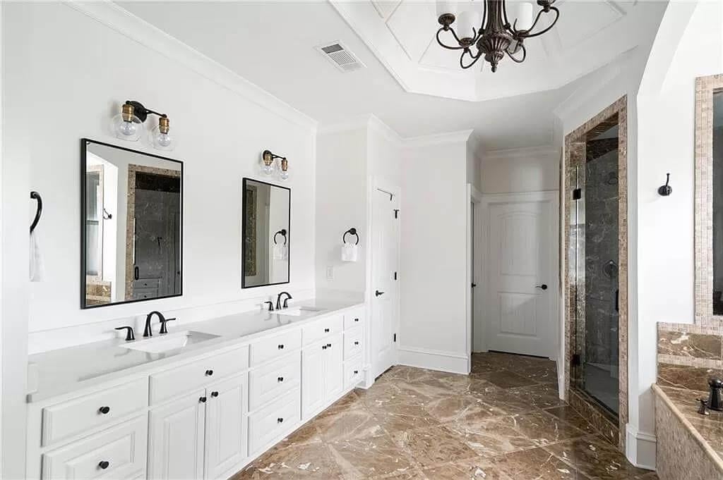 Luxurious Bathroom with Intricate Tray Ceiling and Dual Vanities