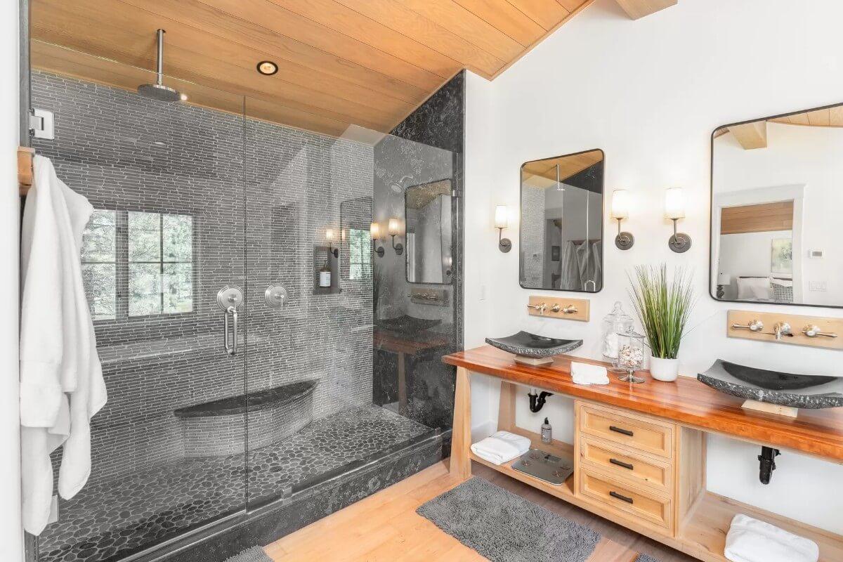 Take a Look at the Pebble-Tiled Walk-In Shower in This Spa-Like Bathroom