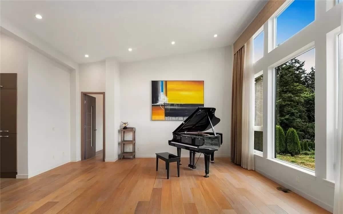 Grand Piano Takes Center Stage Against Expansive Windows