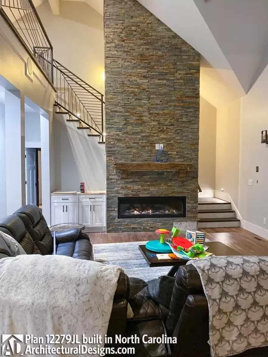 Admire the Stacked Stone Fireplace and Floating Mantel in This Cozy Living Area