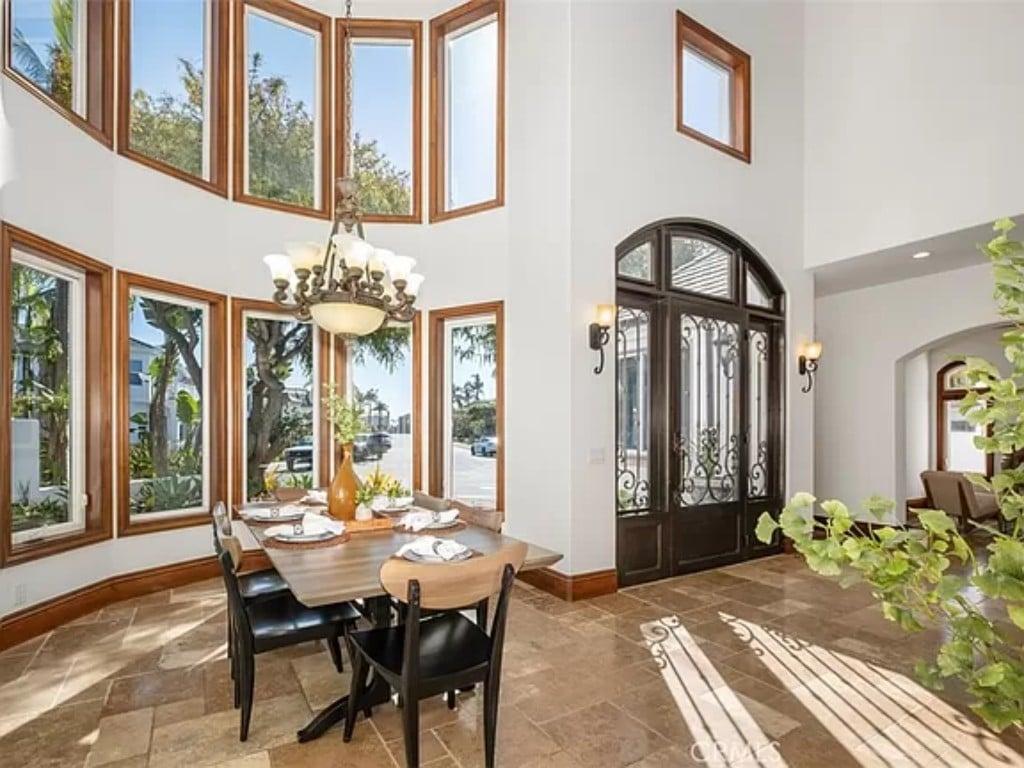 Notice the Dramatic Height and Elegance in This Sunlit Dining Area