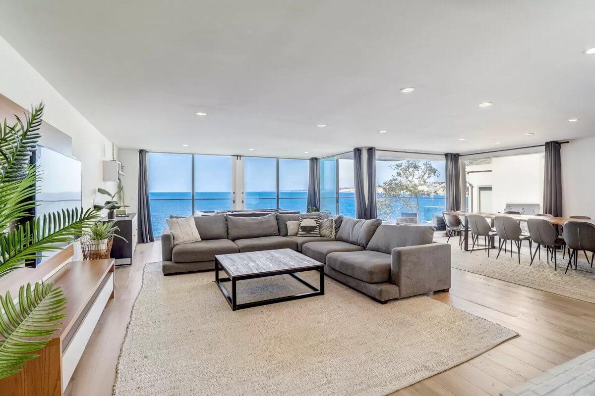 Oceanfront Living Room with Seamless Dining Area Connection