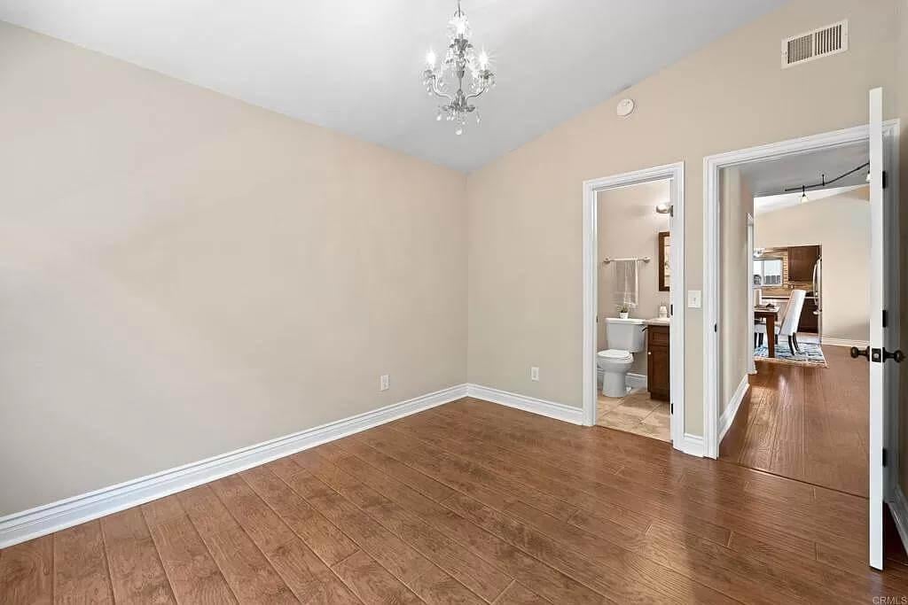 Unadorned Room with a Touch of Elegance Through That Light Fixture