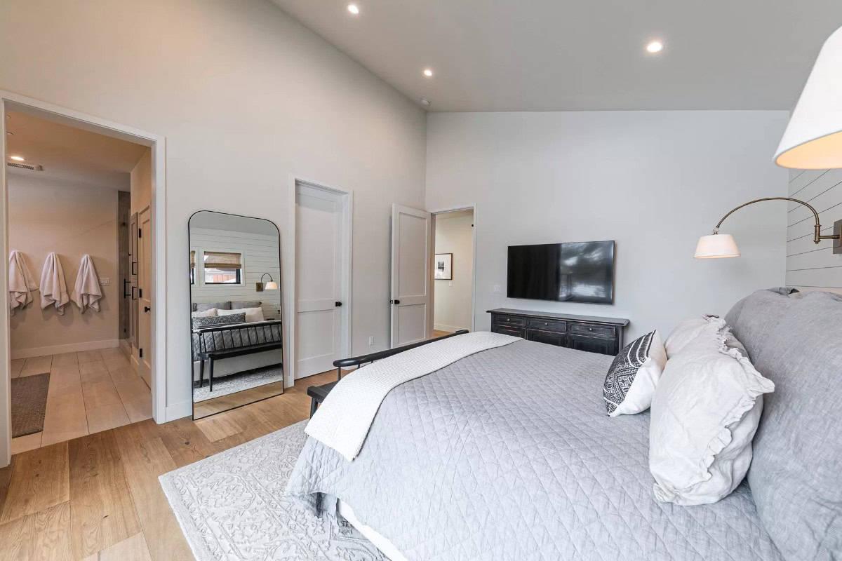 Spot the Stylish Shiplap Wall and Modern Mirror in This Cozy Bedroom