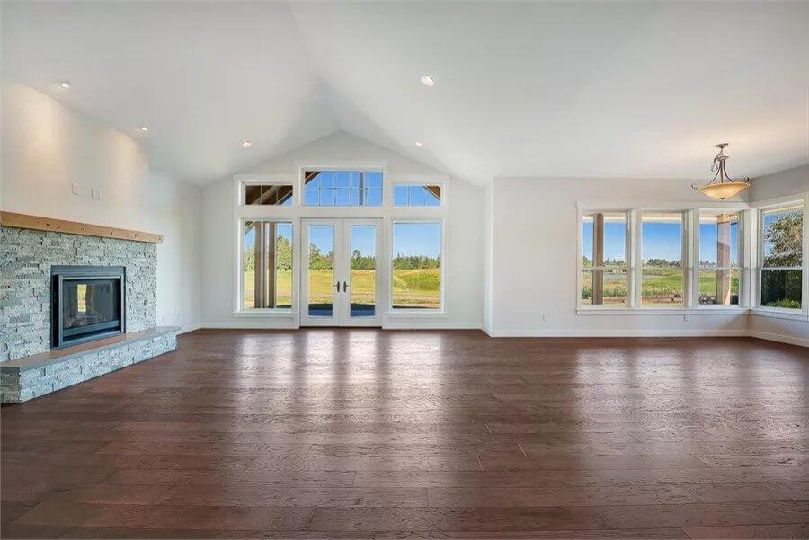 Vaulted Ceiling and Stone Fireplace in an Expansive Living Room