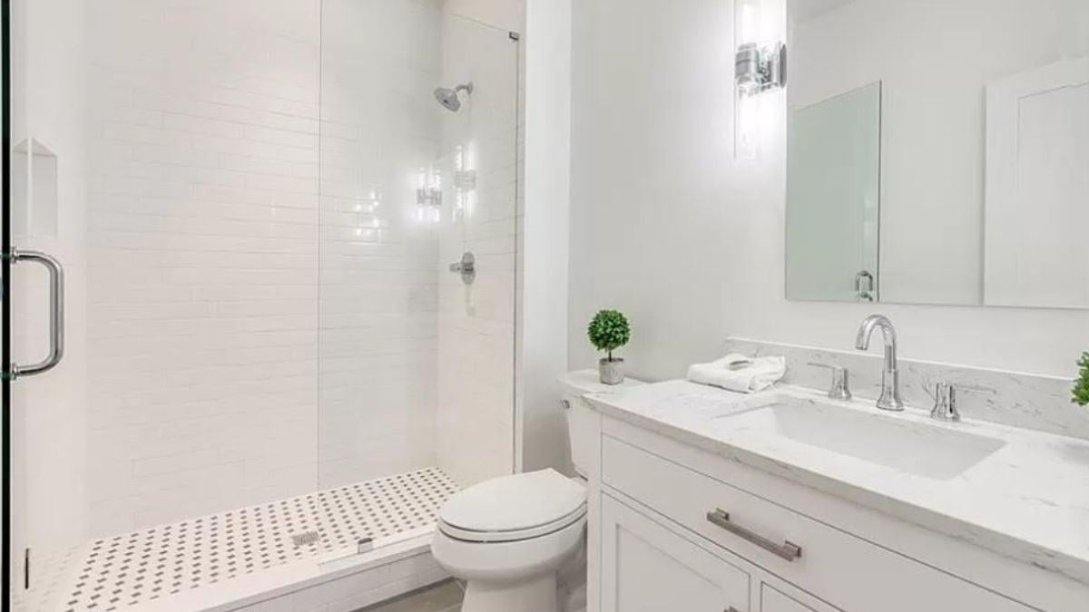 Notice the Clean Lines and Subtle Charm of This White Bathroom