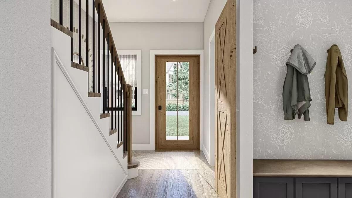 Warm Entryway with Barn Door and Charming Wainscoting