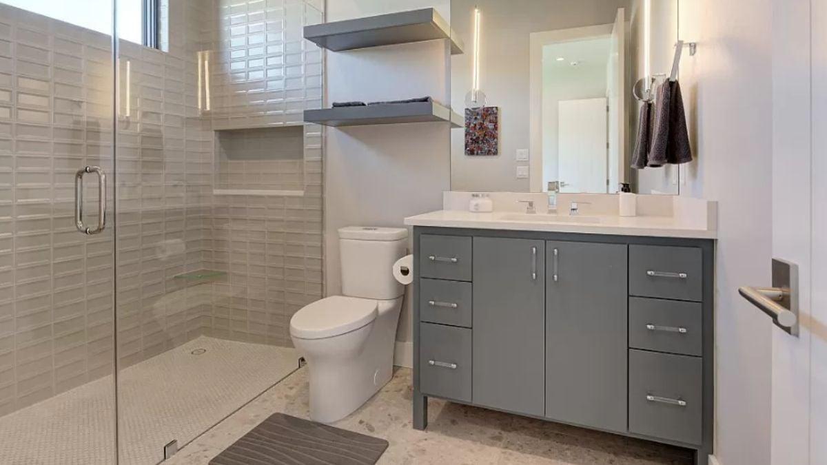 Minimalist Bathroom With Chic Shelving and Textured Tiles