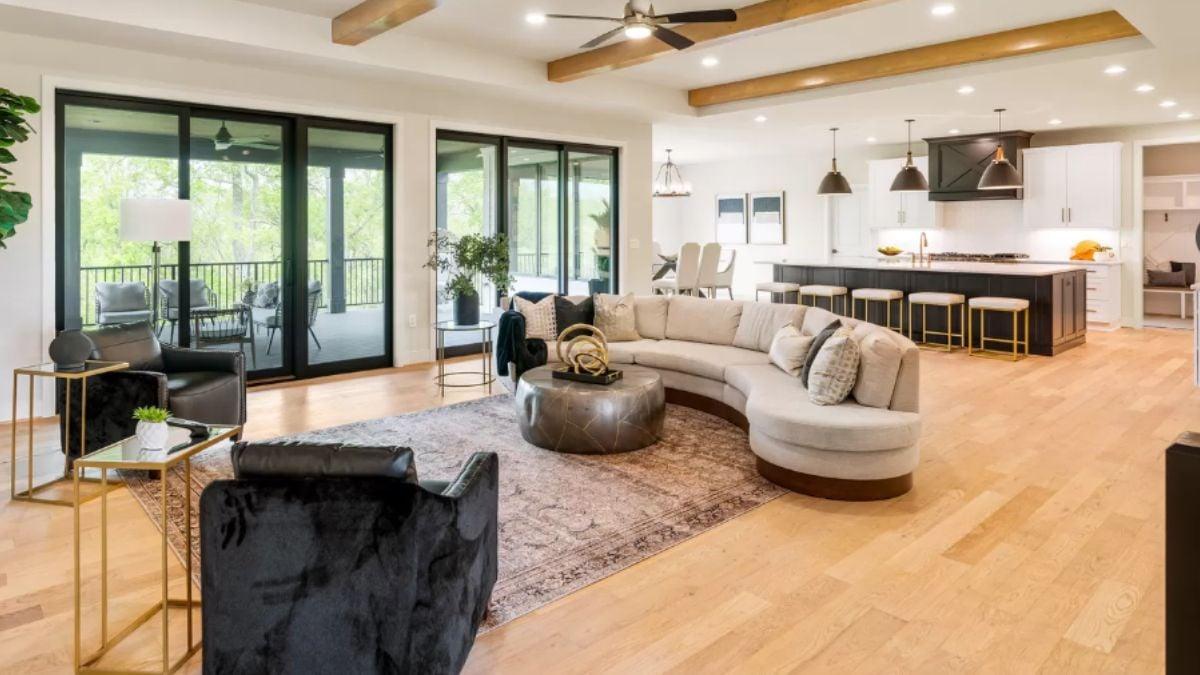 Check Out This Open Living Space with a Gorgeous Curved Sofa
