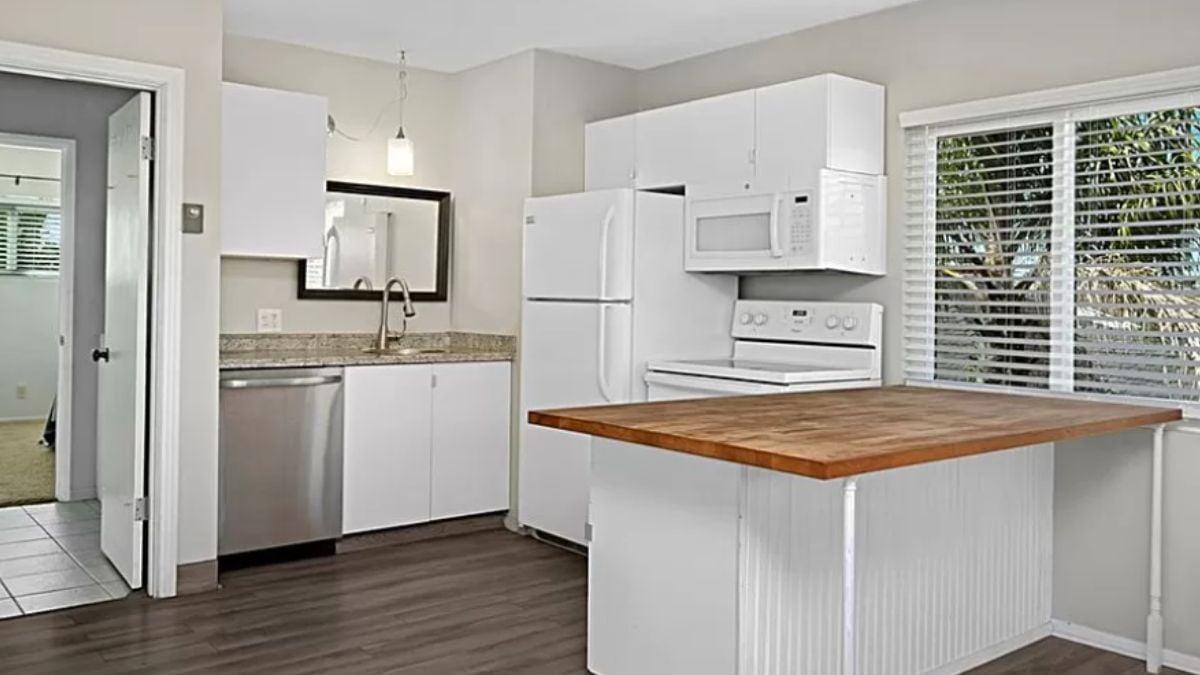 Notice the Butcher Block Countertop in This Bright Kitchen