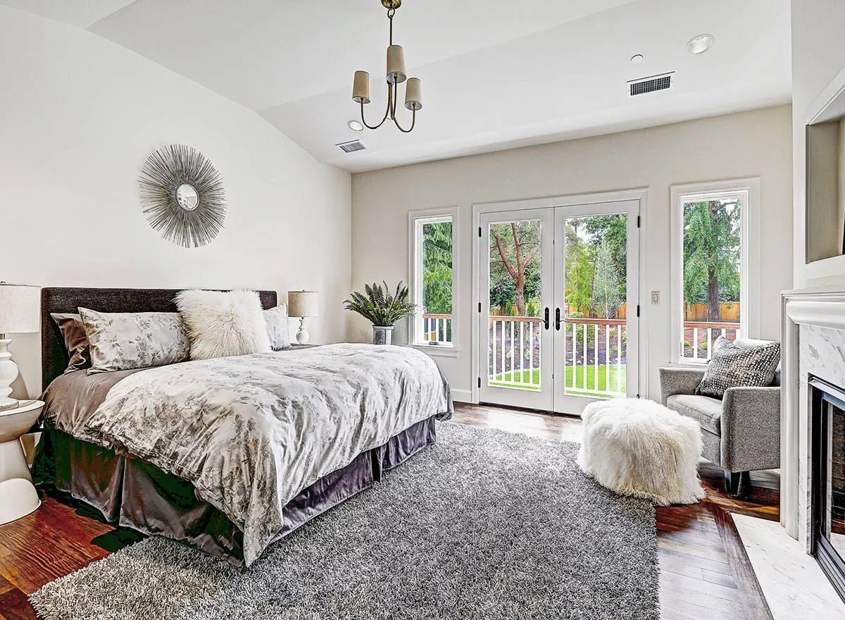 Serene Bedroom Retreat With French Doors and Natural Views